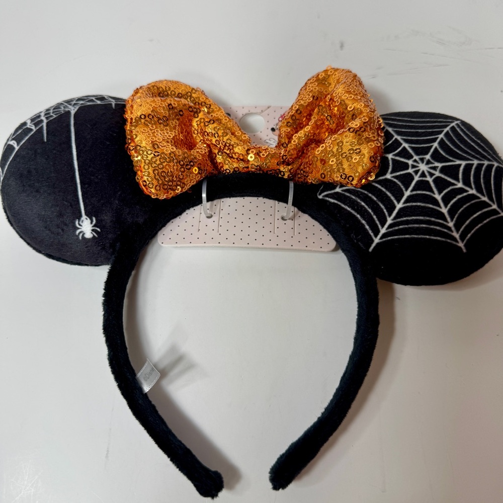 NWT. Primark Halloween headband. Black soft ears with colorful sequin orange bow